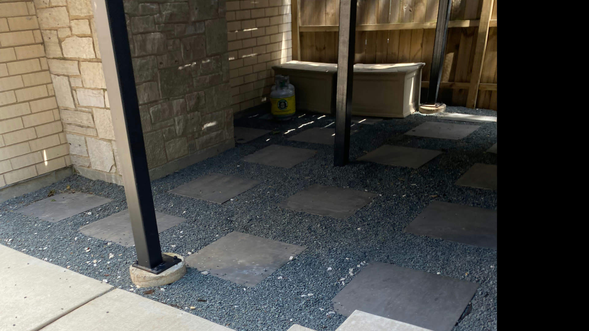 Flagstone and gravel side yard